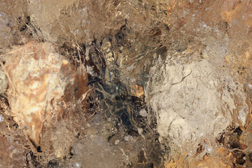 Melting ice in the river creates a beautiful abstract picture.