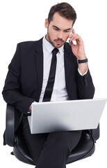 Businessman using laptop while phoning