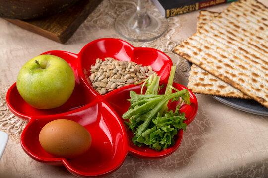 Laid keara table with preparations for the Passover seder and mtz.