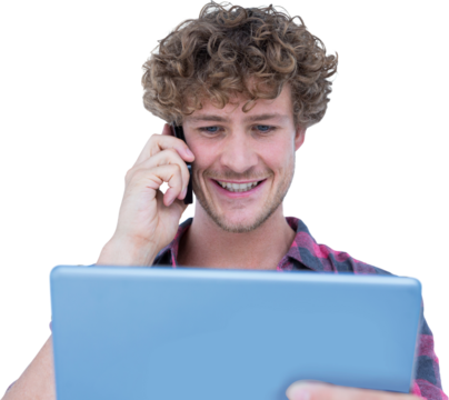 Smiling man talking on mobile phone while looking at digital tablet