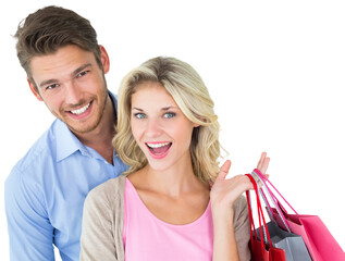 Attractive young couple holding shopping bags