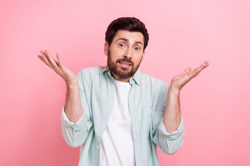 Photo of funny businessman leader young age shrug shoulders wear smart casual shirt no idea where money isolated on pink color background