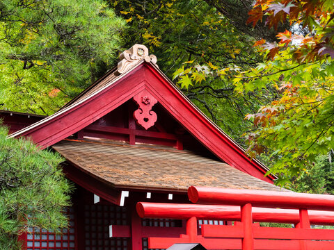 Kiso, Nagano prefecture, Japan - October 23, 2017: Red shinto shrine on the grounds of Kozenji temple