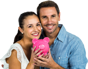 Smiling couple holding pink piggybank