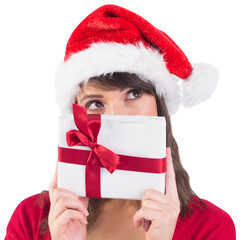Portrait of a festive young woman holding a gift
