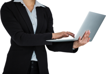 Businesswoman typing on laptop against white background