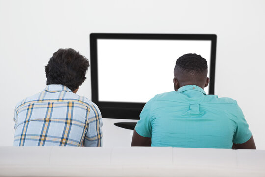 Two Soccer Fans Watching Tv