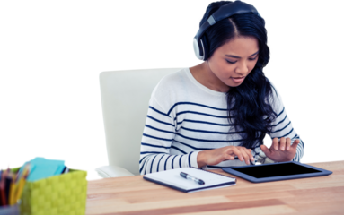 Smiling Asian woman with headphones using tablet