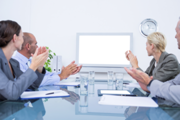 Business team looking at white screen