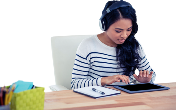 Smiling Asian woman with headphones using tablet