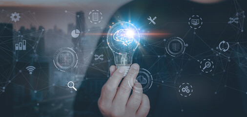 Obraz premium businessman Hand holding light bulb with brain glowing. Creative, new ideas and innovation, Hand holding light bulb and smart brain inside and innovation icon network connection on city background.