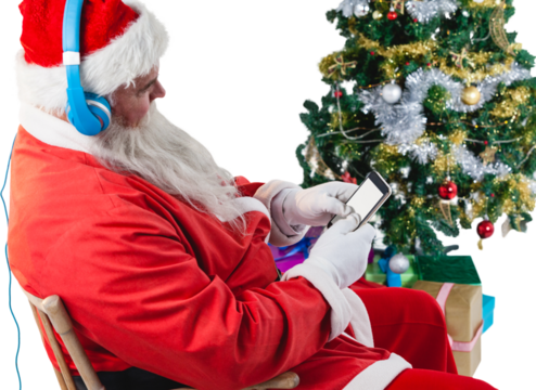 Santa Claus using mobile phone with Christmas tree