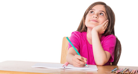 Cute pupil working at her desk