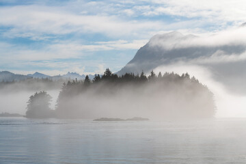 Meares island in the mist seen from Tofino harbor, Vancouver Island, British Columbia, Canada.