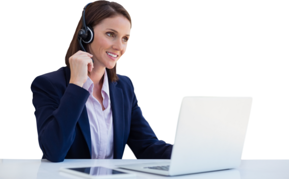 Confident woman wearing headset using laptop at desk