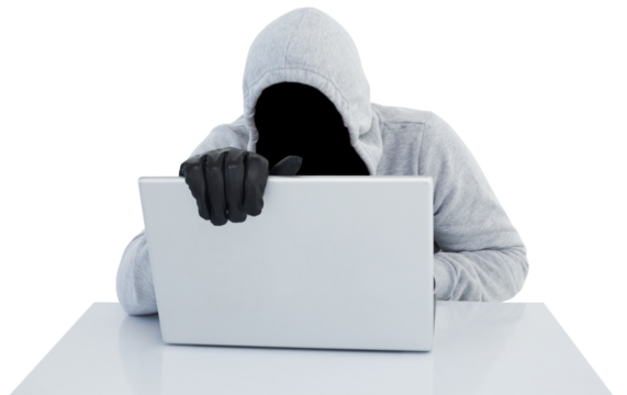 Hiker in gray hoodie and gloves using laptop