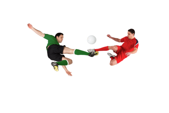 Football players tackling for the ball