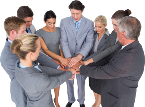Smiling business team standing in circle hands together