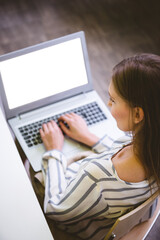 Woman working on laptop in office