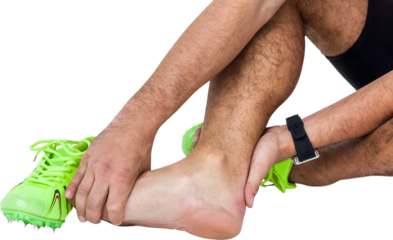 Low section of man holding injured ankle