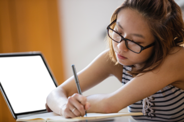 Young woman studying in classroom