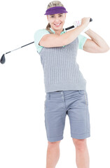 Pretty blonde playing golf