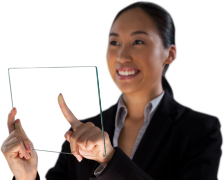 Smiling businesswoman looking away while touching glass interface
