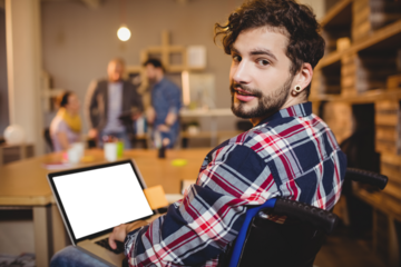 Portrait of graphic designer using laptop