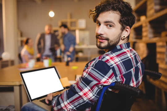 Portrait of graphic designer using laptop - Powered by Adobe