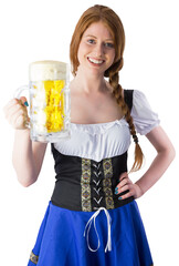 Oktoberfest girl smiling at camera holding beer