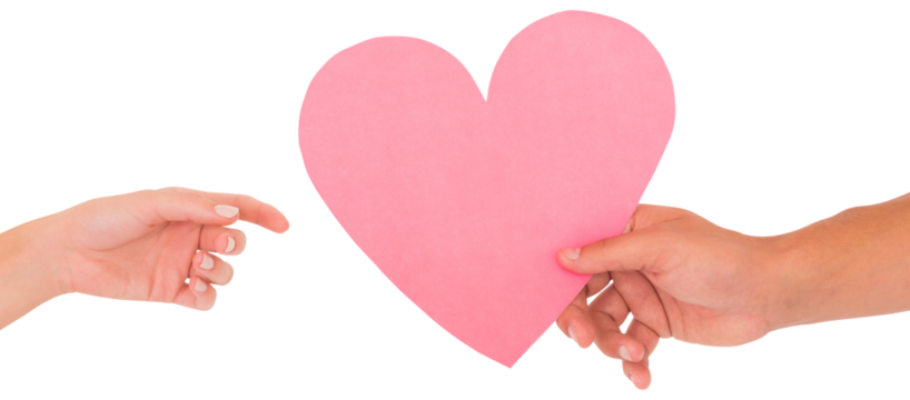 Couple passing a paper heart