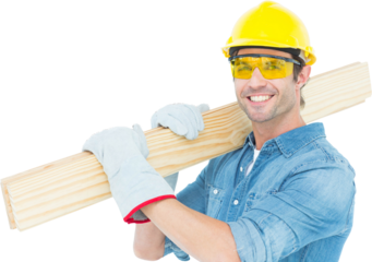 Carpenter wearing hardhat and glasses while carrying wooden planks