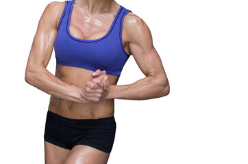 Fototapeta premium Midsection of fit woman with hands clasped 
