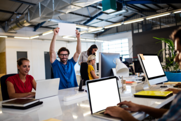 People working on laptop in conference room