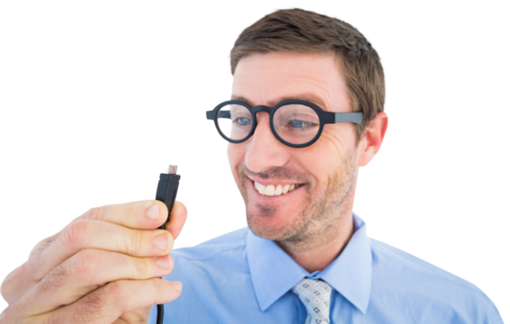Geeky businessman holding a cable