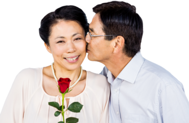Older asian couple with rose
