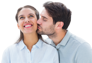 Handsome man kissing girlfriend on cheek
