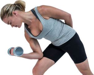 Muscular woman working out with dumbbells