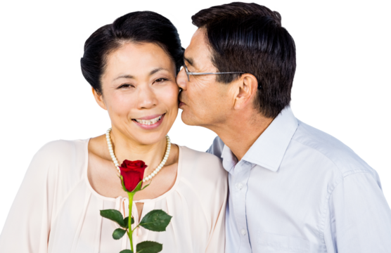 Older asian couple with rose