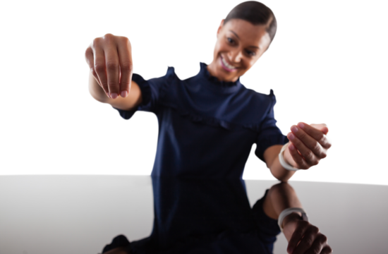 Businesswoman pretending to work on an invisible object