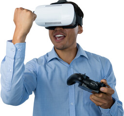 Happy businessman with VR glasses clenching fist while playing video game