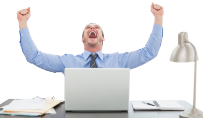 Successful businessman with hands raised sitting at desk