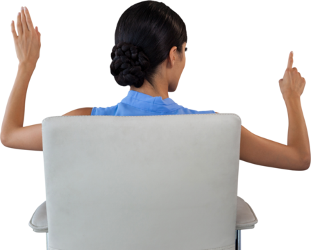 Rear view of businesswoman touching interface white sitting on chair