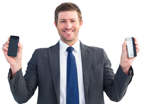 Businessman holding two smart phones