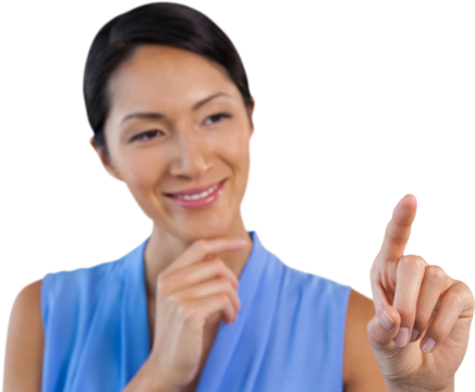 Smiling businesswoman with hand on chin touching interface