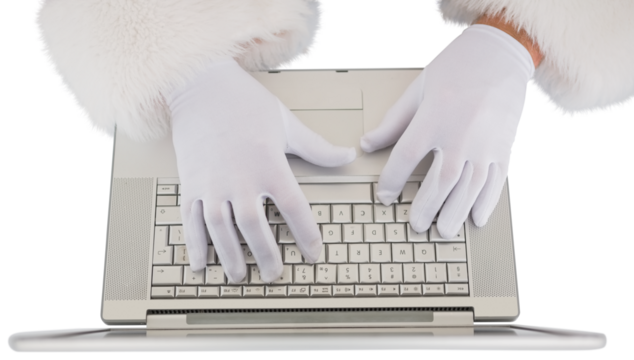 Santa claus typing on laptop 