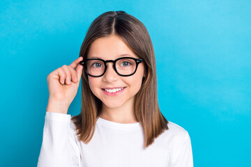 Photo of positive girl with long hairstyle wear white long sleeve finger touch glasses on checkup...