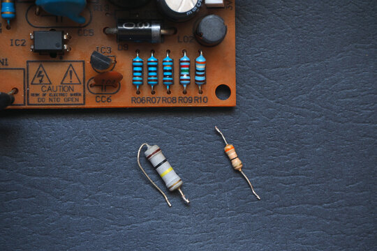 Axial resistors isolated on the table. Resistors on electronic board. 