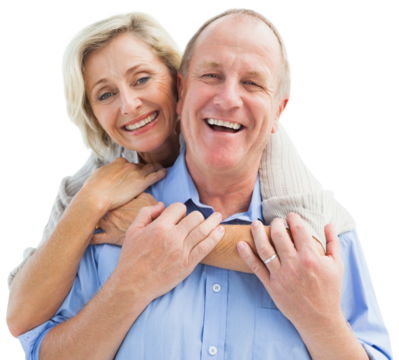 Happy mature couple embracing smiling at camera