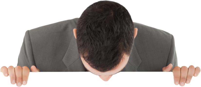 Businessman looking down on sign